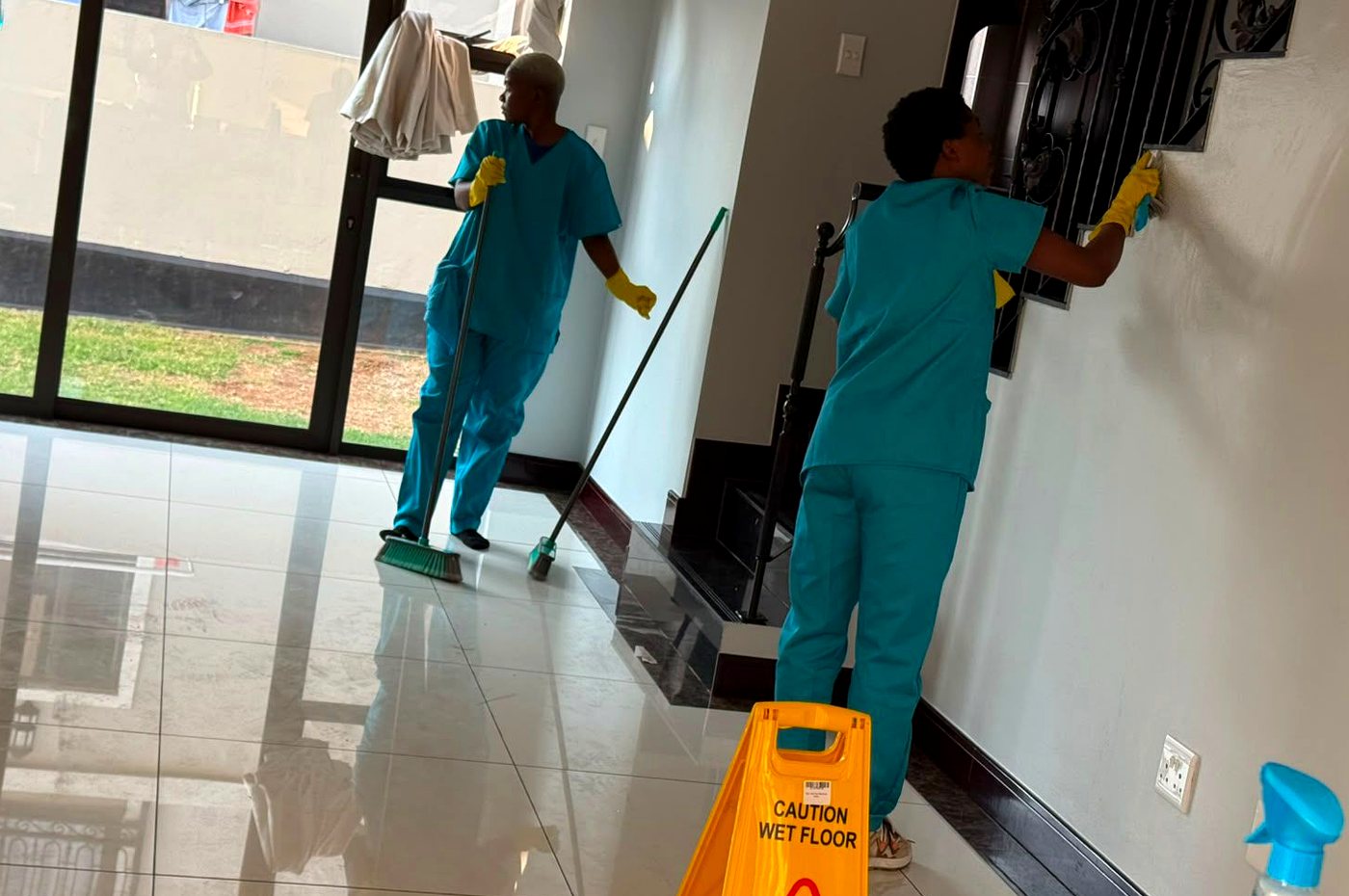 PrimeCare cleaners working inside a home